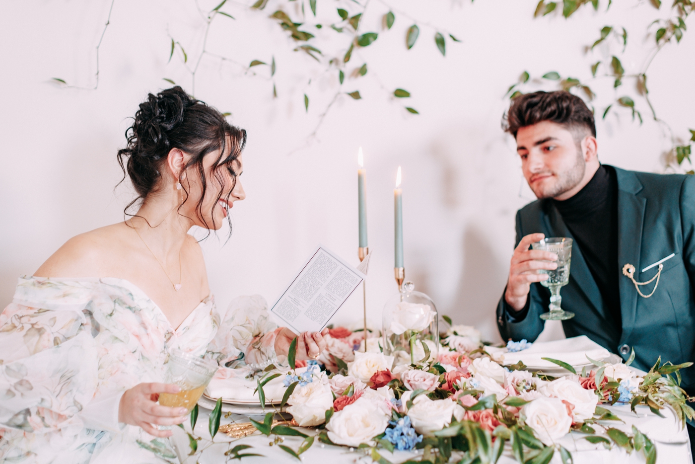 Bride reading a Lady Whistledown pamphlet at a Bridgerton wedding styled shoot